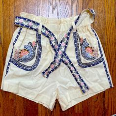 Cream Shorts - Cotton Blend But Cannot Find Content Tag! Feel Like Cotton/Linen Look. Dark Blue And Pink Embroidery And Heading. Pull On Style With Belt. Size S. Smoke And Pet Free Home. Summer Cream Bottoms With Floral Embroidery, Cream Floral Embroidery Bottoms For Summer, Summer Floral Embroidery Cream Bottoms, Cream Cotton Summer Shorts, Summer Cream Cotton Shorts, Cream Shorts For Beach In Spring, Cream Cotton Shorts For Spring, Spring Cream Shorts With Elastic Waistband, Cream Shorts With Elastic Waistband For Spring