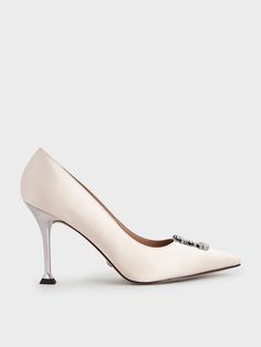 Add feminine flair to your evening look with these satin pumps in a flattering cream colour. These heels feature a pointed toe that helps to elongate your frame, while the gem embellishments imbue a sense of class and elegance. Go full glam by matching these shoes with a shimmered layered gown and beaded clutch for a dinner and dance event. Layered Gown, Full Glam, Dance Event, Kids Belt, Amazing Wedding Dress, Cream Wedding, Satin Heels, Cream Colour, Satin Pumps