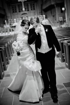 the bride and groom are walking down the aisle