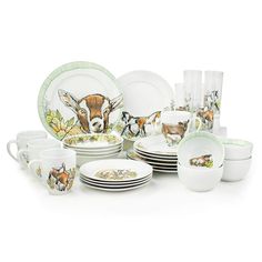 an assortment of dishes and cups with animals on them