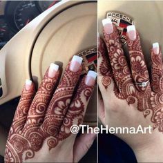 two hands with henna designs on them and one has a ring in the middle