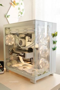 a white computer case sitting on top of a desk