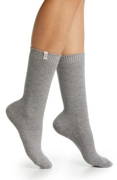 These logo-branded socks feature soft yarn knit in a textured stitch that will pair perfectly with your favorite boots. Nylon/polyester/acrylic/merino wool/elastane Machine wash, tumble dry Imported Comfortable Lightweight Winter Socks, Warm Gray Casual Socks, Trendy Gray Knee-high Winter Socks, Fitted Knitted Gray Socks, Cozy Gray Comfortable Socks, Snug Gray Winter Socks, Classic Ugg Boots, Favorite Boots, Classic Boots