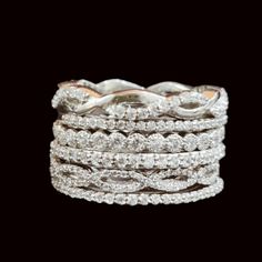 a stack of white gold and diamond bracelets