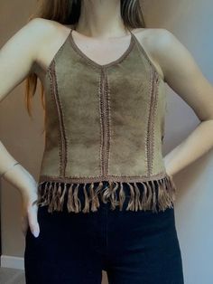 Pocahontas suede leather halter top  Perfect festival top  Very soft nice leather  Vintage  Made by Apart Size  L modeled on M Zipper on back  100% leather  Very good vintage condition, no marks or holes  Between underarms 52cm 20,5" Length without halter and fringes 39cm 15,2" Leather Halter Top, Leather Halter, Boho Fringe, Festival Tops, Nice Leather, Pocahontas, Leather Top, Halter Top, Suede Leather