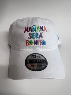 -MAÑANA SERA BONITO (KAROL G) -New Era 9Twenty Dad Hat -color: White Casual Multicolor Fitted Hat With Flat Brim, Casual Multicolor Curved Brim Fitted Hat, Casual Multicolor Fitted Hat With Curved Brim, Casual Multicolor Adjustable Fitted Hat, Multicolor Casual Fitted Hat, Multicolor Adjustable Casual Hat, Adjustable Multicolor Fitted Hat, Multicolor Curved Brim Hat With Letter Print, Casual Multicolor Letter Print Hats