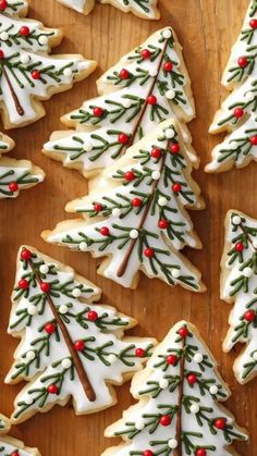 christmas cookies decorated with white and green icing on a wooden surface, the words 50 white desserts for a white christmas