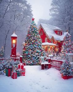 a christmas tree in front of a red house with lights and presents on the ground