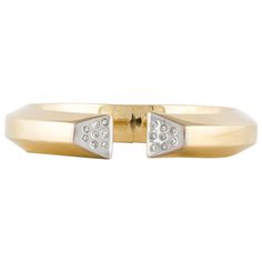 Modern hinged bracelet in 18K yellow gold with round diamonds set in 18K white gold. There are sixteen round diamonds totaling 0.35 carats; G-H color and SI1-I1 clarity. The top is 7/16 inches wide and the inside diameter is 2 3/16 inches. Cartier Bangle, Indian Diamond Jewellery, White Gold Bangle, Round Diamond Setting, Yellow Gold Bangle, Modern Bracelets, Antique Bracelets, Bangles Making, Diamond Bangles Bracelet