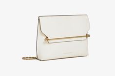 A truly timeless silhouette, the Stylist is designed to take you effortlessly from day to night. Featuring our signature Strathberry music bar as a functional closure, this soft, structured clutch offers ample storage for all your evening essentials. The definition of versatility, this large purse can be transformed into a crossbody bag, when worn with the detachable gold chain strap. Music Bar, Large Purse, Travel Companion, Cross Body Bag, Leather Clutch, Body Bag, Chain Strap, Gold Chain, Gold Chains