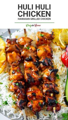 chicken skewers with rice and cucumber on the side