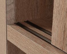 a close up view of the wood grains on this cabinet door handle and drawer