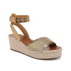 Franco Sarto-Pamala Wedge Sandal Make your spring ensemble pop with the gorgeous Pamala wedge sandal from Franco Sarto. An asymmetrical strap detail brings all the attention to the jute-covered wedge sandal, ideal for flowy spring dresses. Partially recycled materials in the composition encourage sustainable wear. Flowy Spring Dresses, Espadrille Wedge, Famous Footwear, Franco Sarto, Wedge Sandal, Espadrilles Wedges, Spring Dresses, Synthetic Leather, Wedge Heels