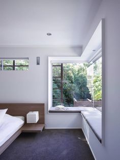 a bedroom with a bed and window in it