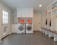 a washer and dryer in a large laundry room