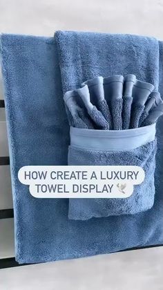 there is a blue towel that has been folded in a pocket with the words how create a luxury towel display on it