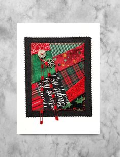 a christmas card with red, green and black fabric