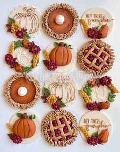 decorated cookies arranged in the shape of pies and pumpkins