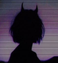 the silhouette of a person with long black hair and horns on their head is shown in front of a purple background