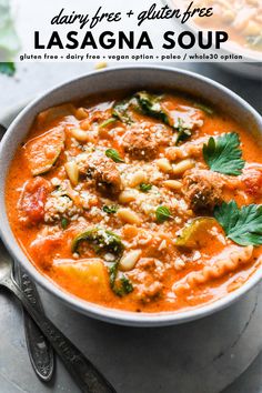 a white bowl filled with pasta and meat soup