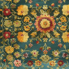 an ornately designed rug with flowers and leaves