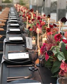 a long table is set with flowers and candles for an elegant dinner or party event