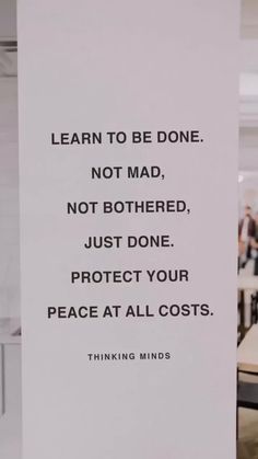 a sign that says learn to be done not mad, not bothered, just done protect your peace at all costs