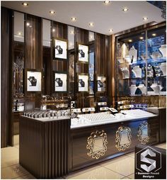 the interior of a jewelry store with many items on shelves and pictures hanging from the wall