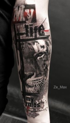 a man's leg with a lion tattoo on it and the words, my life is