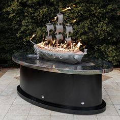 a fire pit with a boat on it