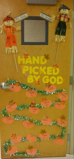 a door decorated with pumpkins and hand picked by god