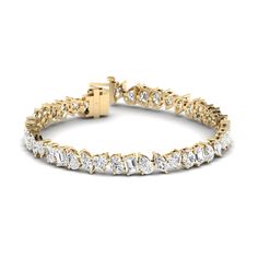 The multi-shaped diamond tennis bracelet is handcrafted in 14K or 18K yellow, rose, or white gold, and round, brilliant-cut white diamonds. A beautiful bracelet with timeless appeal that can be worn anywhere. It makes the perfect gift for yourself or someone you love, because diamonds are always forever. 14K or 18K gold 14.19 ct diamonds 45 white diamonds D-E-F color heart diamonds (all colors and grades available upon request) Diamond clarity is VVS-VS Secure insert clasp with safety link for safety, diamonds continuous on clasp Available in Yellow Gold, Rose Gold and White Gold Made with love in Los Angeles Complimentary gift wrapping provided Made to order depending upon size of diamonds desired and design. Most custom multi-shape tennis bracelets can be fabricated within 2-3 days, with Halo Band, Bezel Set Earrings, Signature Bracelet, Necklace Top, Always Forever, Diamond Stacks, Nature Inspired Rings, Trending Engagement Rings, Bridal Diamond Jewellery