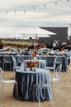 tables and chairs are set up for an outdoor event