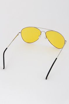 Big '70s vibes with theses yellow lens sunglasses and oversized frame Approx. size: 2.2" x 6" Metal frame Yellow Lens Sunglasses, Tinted Aviator Sunglasses, Sunglasses Oversized, Black Aviator Sunglasses, 70s Vibes, Rose Gold Frame, Tinted Sunglasses, 70s Inspired, Sunglasses Sale