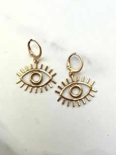 Eye Earrings - Bohemian Earrings - Eyeball Earrings - Evil Eye Earrings Handmade with love in Memphis, TN.  Features: -Gold ion-played stainless steel ear huggie hoops - tarnish free and hypoallergenic -Shiny solid brass eye charms Trendy Hypoallergenic Brass Earrings, Symbolic Teardrop Earrings, Metal Symbolic Hypoallergenic Earrings, Eyeball Earrings, Nose Ring Jewelry, Princess Fashion, Evil Eye Earrings, Druzy Earrings, Earrings Bohemian