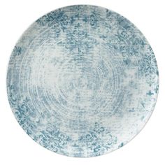 a blue and white plate with an intricate design on the rim, against a white background