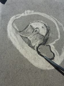 a drawing of a mouse on the ground with a paintbrush in front of it