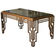 an art deco coffee table with glass top