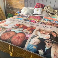 a bed with many pictures on it and the sheets have been pulled back to reveal an image