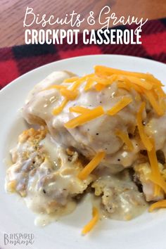 biscuits and gravy crockpot casserole on a white plate with cheese