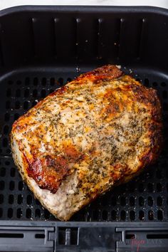 a piece of meat sitting on top of a grill