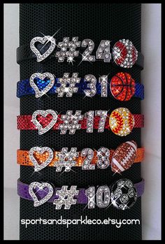 an assortment of sports themed bracelets with swarong hearts and balls on them