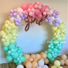 balloons are arranged in the shape of a wreath