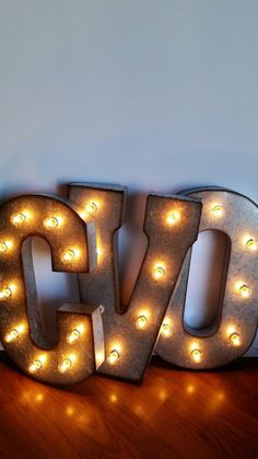 lighted letters spelling out the word love on a table