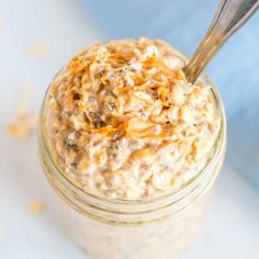 a jar filled with oatmeal sitting on top of a table