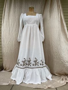 "Long Gunne Sax style dress in white with brown dots and embroidery on the skirt. The dress is brand new. It was made using a pattern from 1972. It has a square neckline, long sleeves with elastic at the wrist. The fabric is 100% cotton. It is a 1970s size 16 for measurements 38-29-40. I do not know what size that corresponds to in current sizes. Total length 55\" Flounce length 9.5\" Sleeve length 25\" Elastic at wrist 8.5\" Waist 36\" measurement at the skirt gather which is above the natural Gunne Sax, Prairie Dress, Dress Form, A Pattern, Dress Clothes For Women, Style Dress, Square Neckline, Size 16, Vintage Style