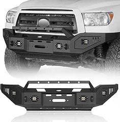 the front and rear bumpers of a white truck with black grill guards on it