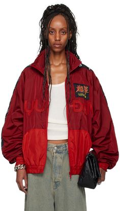 Nylon satin track jacket. · Stand collar · Zip closure · Logo patch and appliqués at front · Patch pockets · Elasticized hem and cuffs · Logo graphic-woven trim at raglan sleeves · Full mesh lining Supplier color: Oxblood/Red Red Track Jacket Outfit, Red Letterman Jacket, Soccer Jacket Outfit, Windbreaker Nike, Wind Breaker Outfit, Track Jacket, Track Jacket Outfit, Windbreaker Outfit, Red Windbreaker