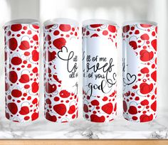 three red and white coffee mugs with hearts on them