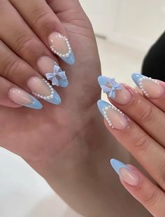 Blue Nails Cinderella, Blue Bow Nail Designs, Light Blue Nails With Charms, Baby Blue Nails With Butterflies, Light Blue Coquette Nails, Baby Blue Pearl Nails, Light Blue Pearl Nails, Baby Blue Nails With Flowers, Almond Nails Baby Blue